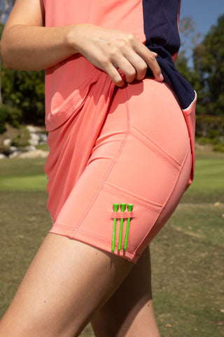 women's skort in coral for golf in sizes xs-xxl